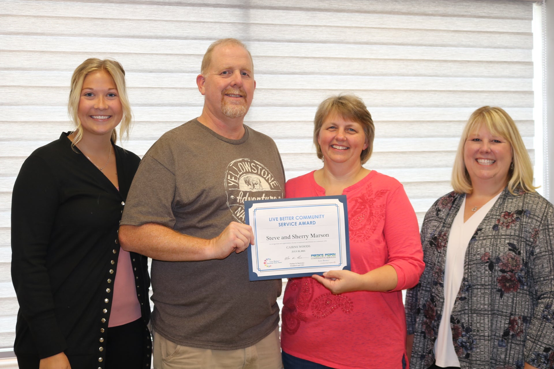 Steve and Sherry Marson (center) received the Live Better Award